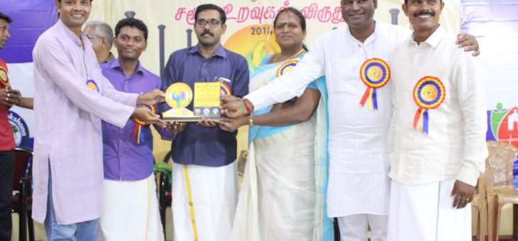Anumuthu receiving memento for the social work